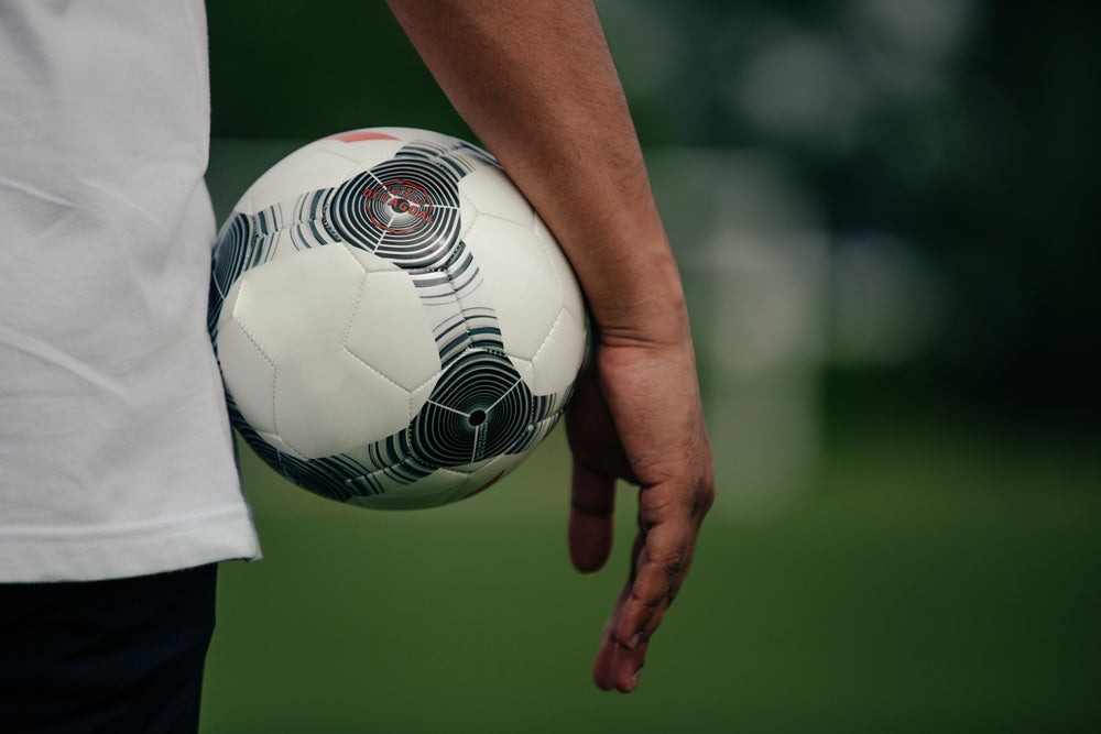 close-up-holding-soccer-ball